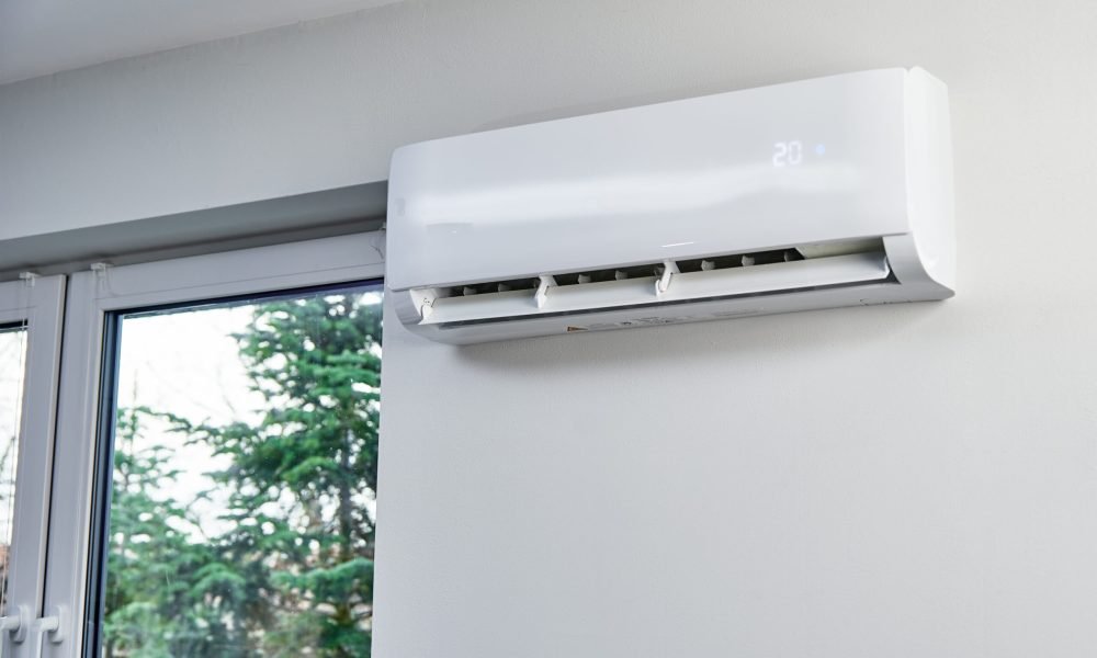 Adjusting temperature on air conditioner, Working air conditioner for comfort temperature in home at hot summer, cooling air in the room